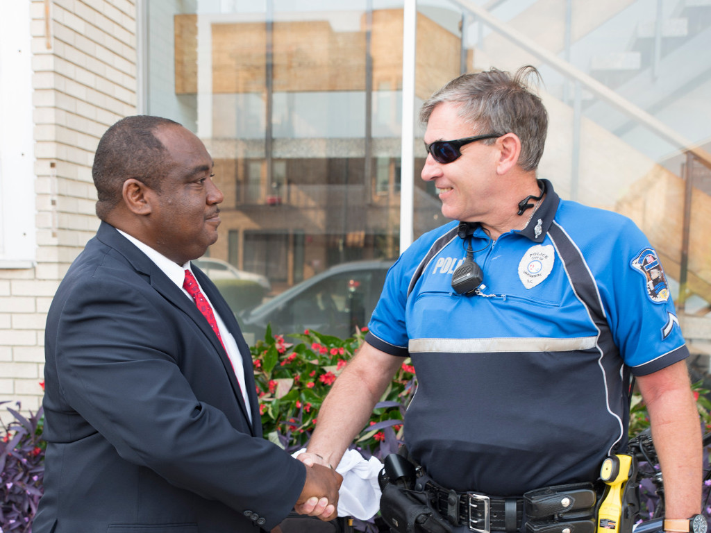 Photo of Mike Fowler in front of One Spartanburg painting
