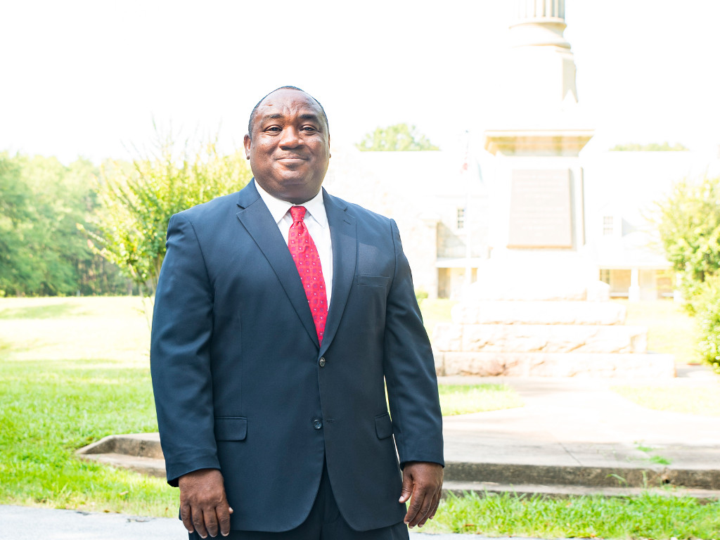 Photo of Mike Fowler in front of One Spartanburg painting