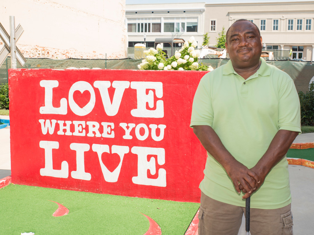 Photo of Mike Fowler in front of One Spartanburg painting
